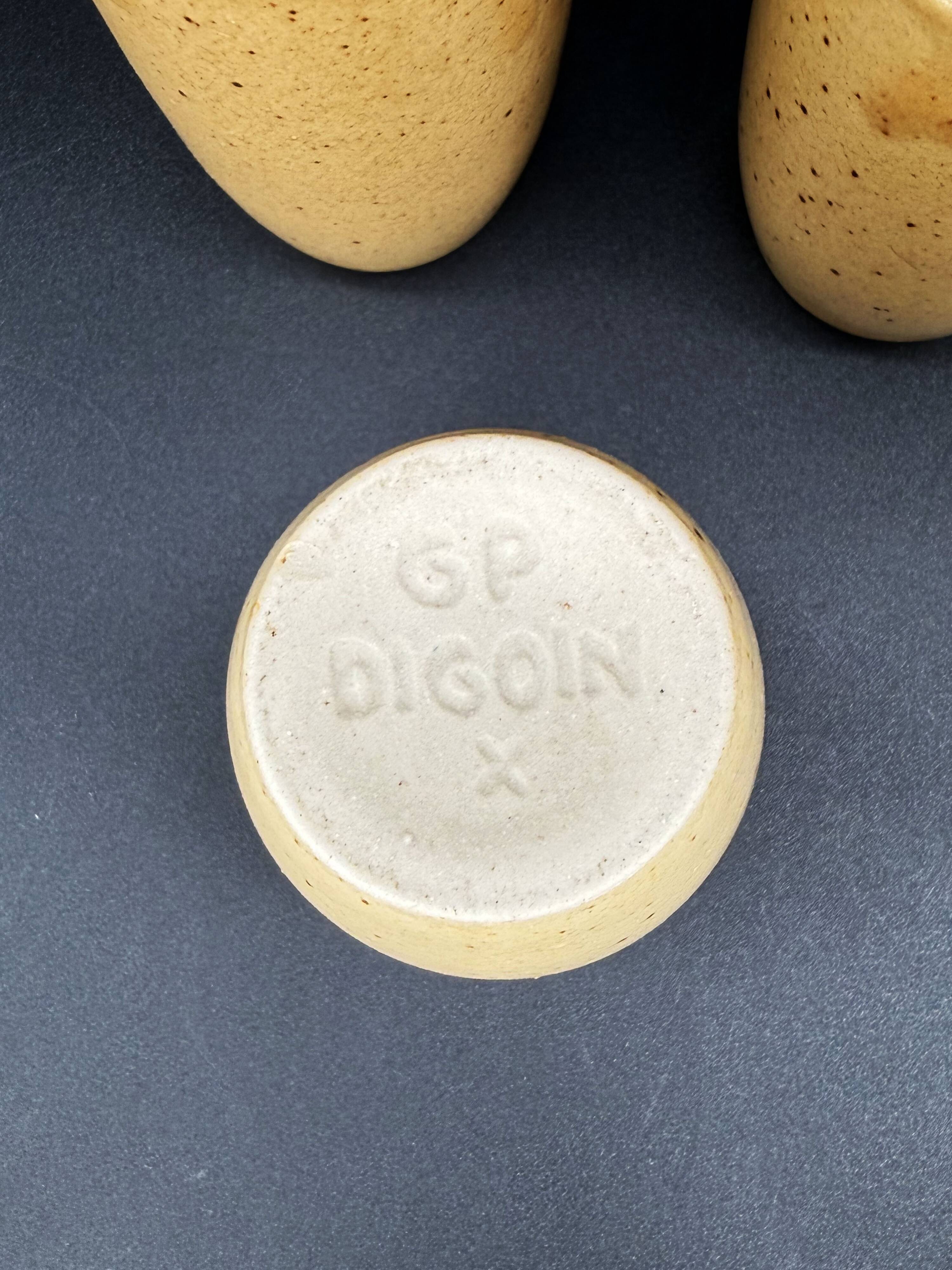 10 glazed stoneware cups signed Digoin