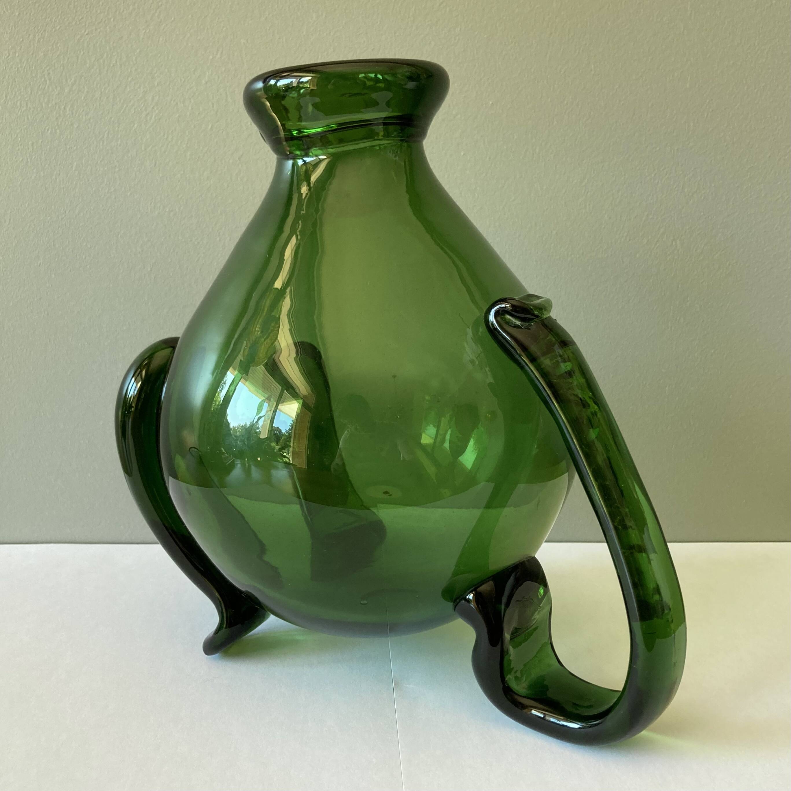 Amazing pitcher; vintage tripod jug or carafe in blown and hot-worked green glass