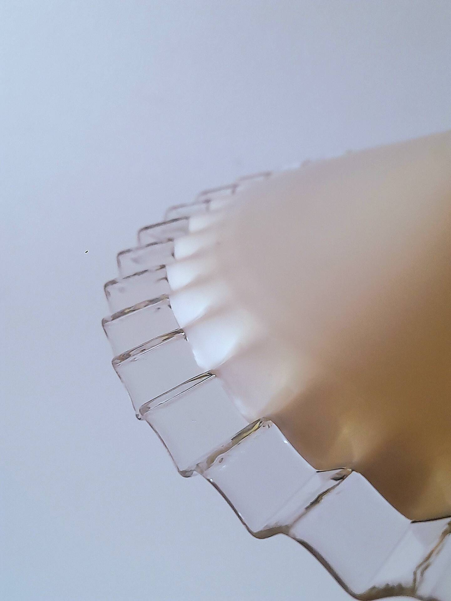Suspension in pleated opaline