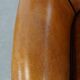 Cognac-colored sheep leather armchair finished with decorative nails