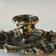 Antique Baroque/Rocaille style hand candle holder. In bronze with an old gold patina.