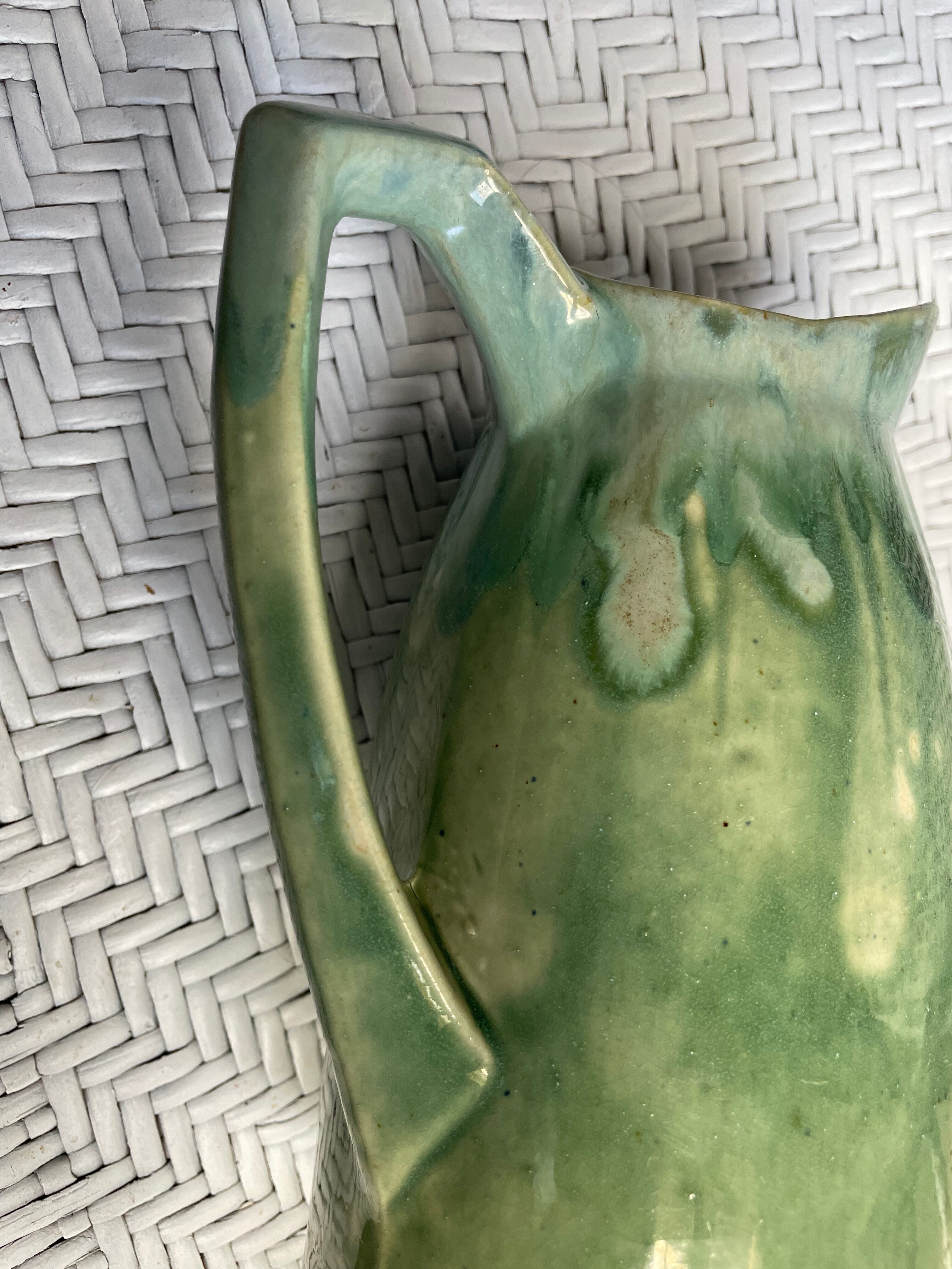 Turquoise green enamelled ceramic pitcher