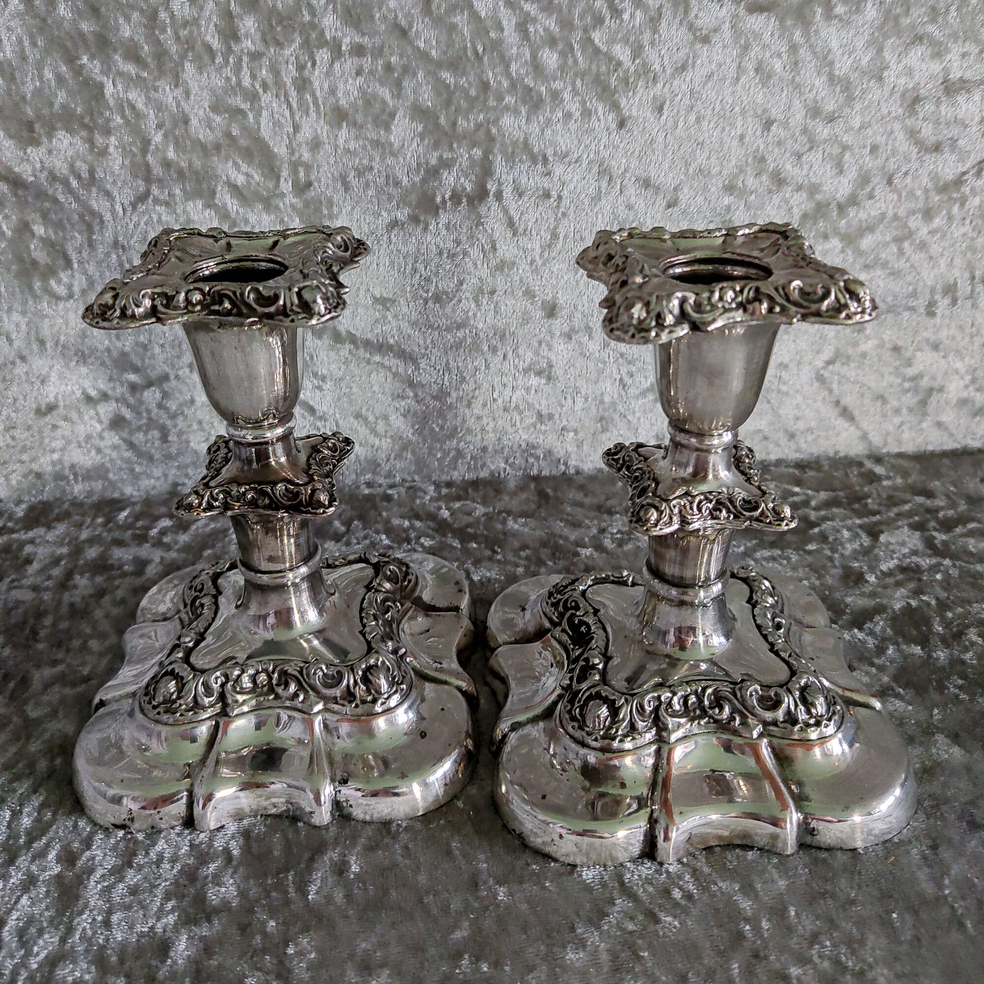 Pair of silver metal candle holders