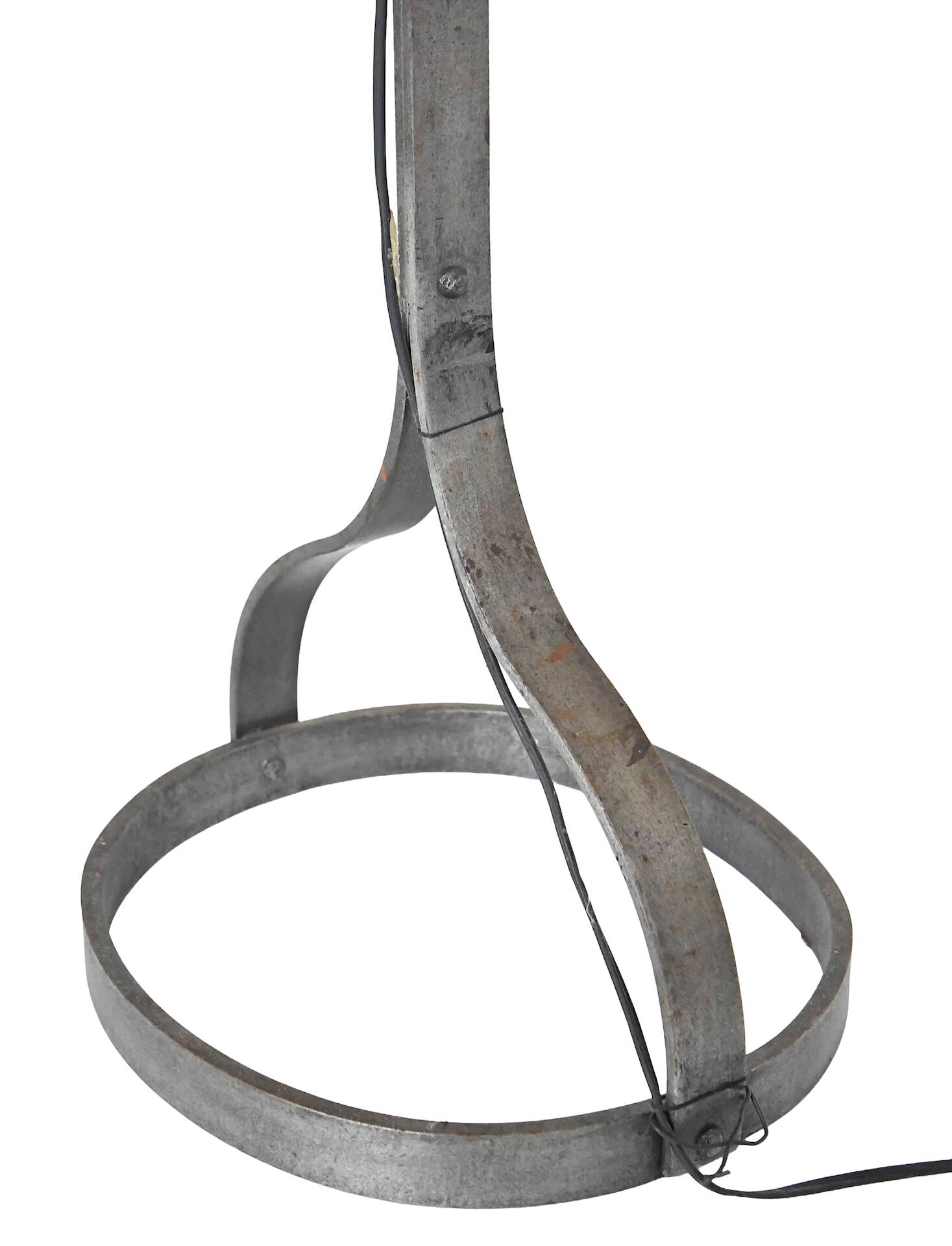 Wrought iron and leather floor lamp in the style of Jean-Pierre Ryckaert.