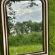 Louis Philippe mirror, wood and stucco with faux wood decoration. 19th century. 56 x 74.