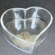 Empty glass heart-shaped pocket