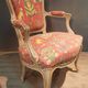 Louis XV style armchair upholstered with an Egyptian pattern.
