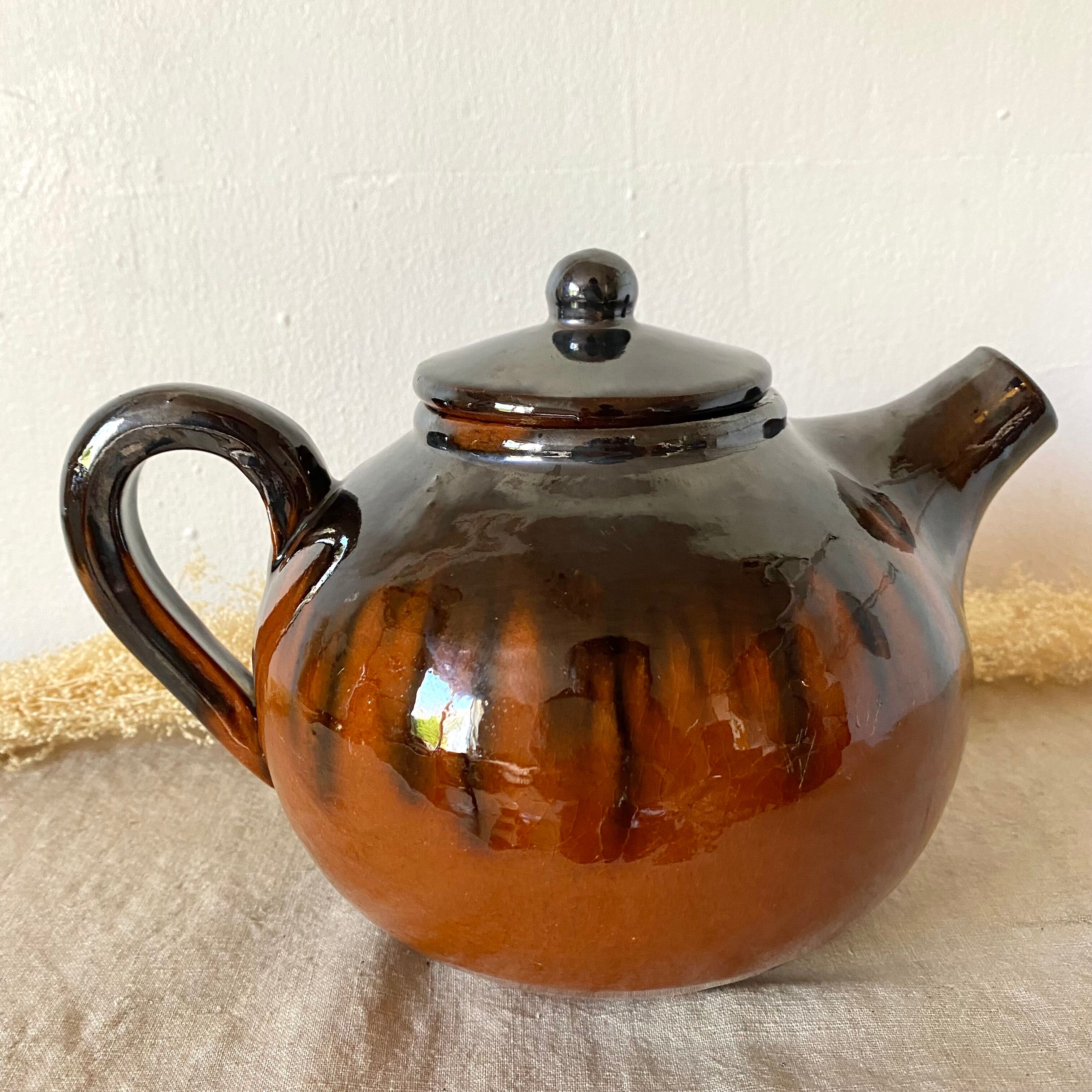 Glazed terracotta teapot