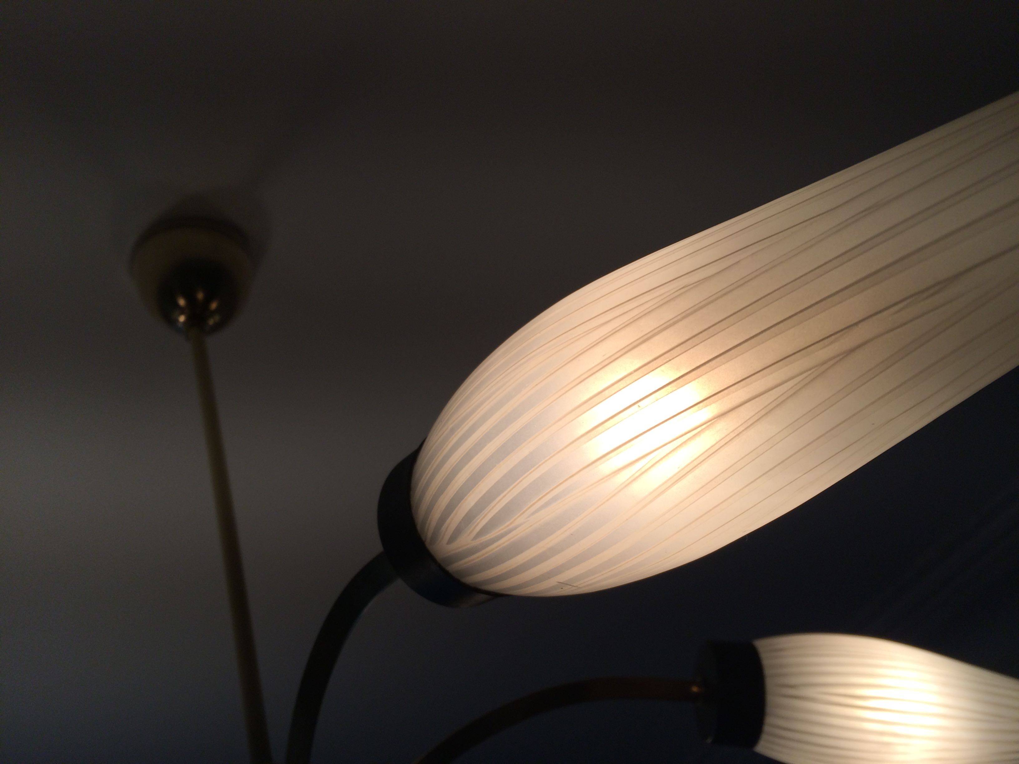 Lustre with 5 branches from the 1960s - 1970s in solid brass and black metal.