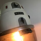 Vintage hairdresser's armchair with helmet transformed into a lamp