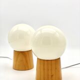 Pair of lamps with wooden base and glass globe, 1970s