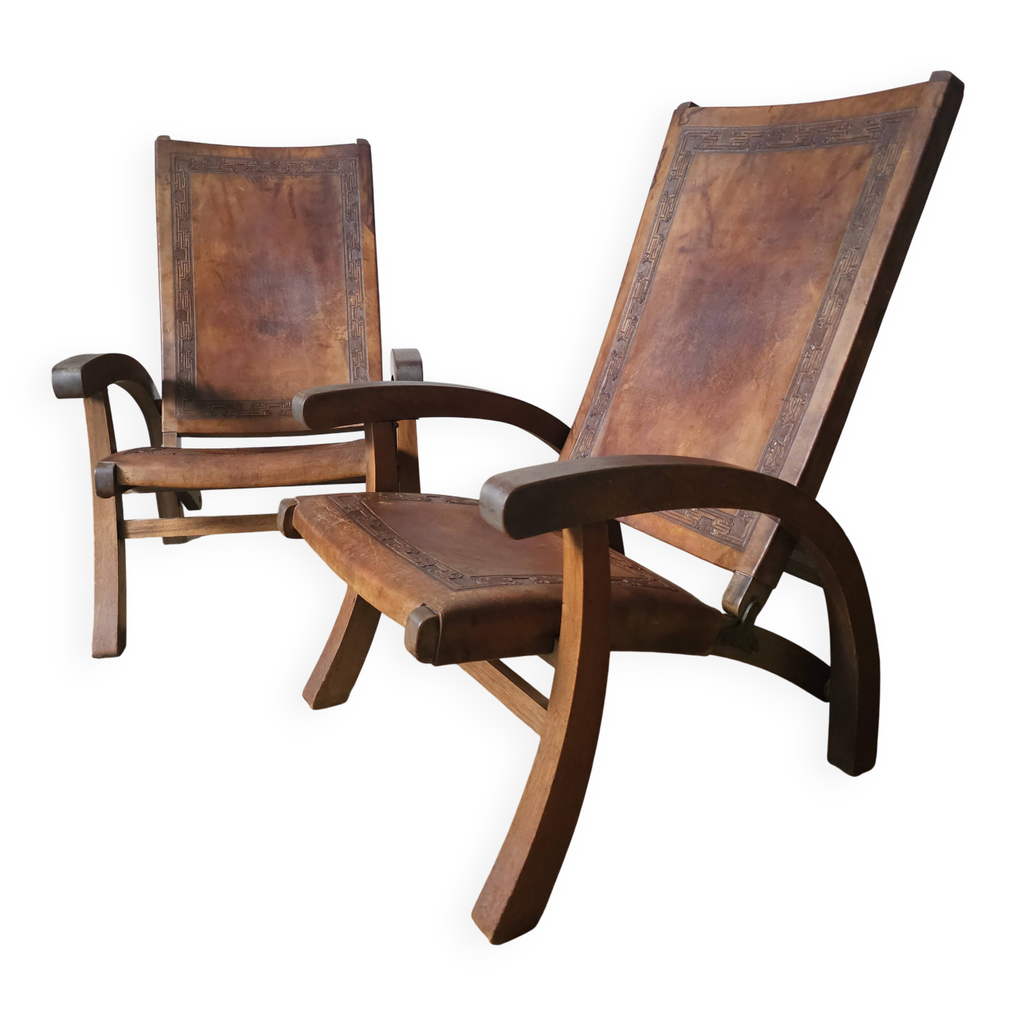 Leather and teak armchairs, by Angel Pazmino, circa 1960.