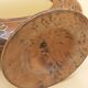 Antique mirror on wooden stand and metal net
