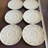 White saucer with raised inlaid pattern