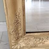 Wood and gilded stucco mirror, 19th century, 115 x 61.5 cm.