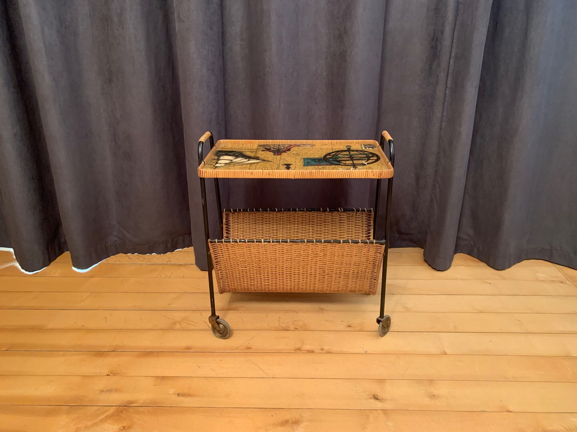 Mobile side table with newspaper holder , Germany , 1960s .