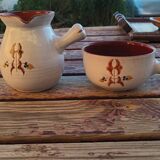 2 beige ceramic pots painted with signature