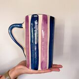Blue and purple striped ceramic pitcher