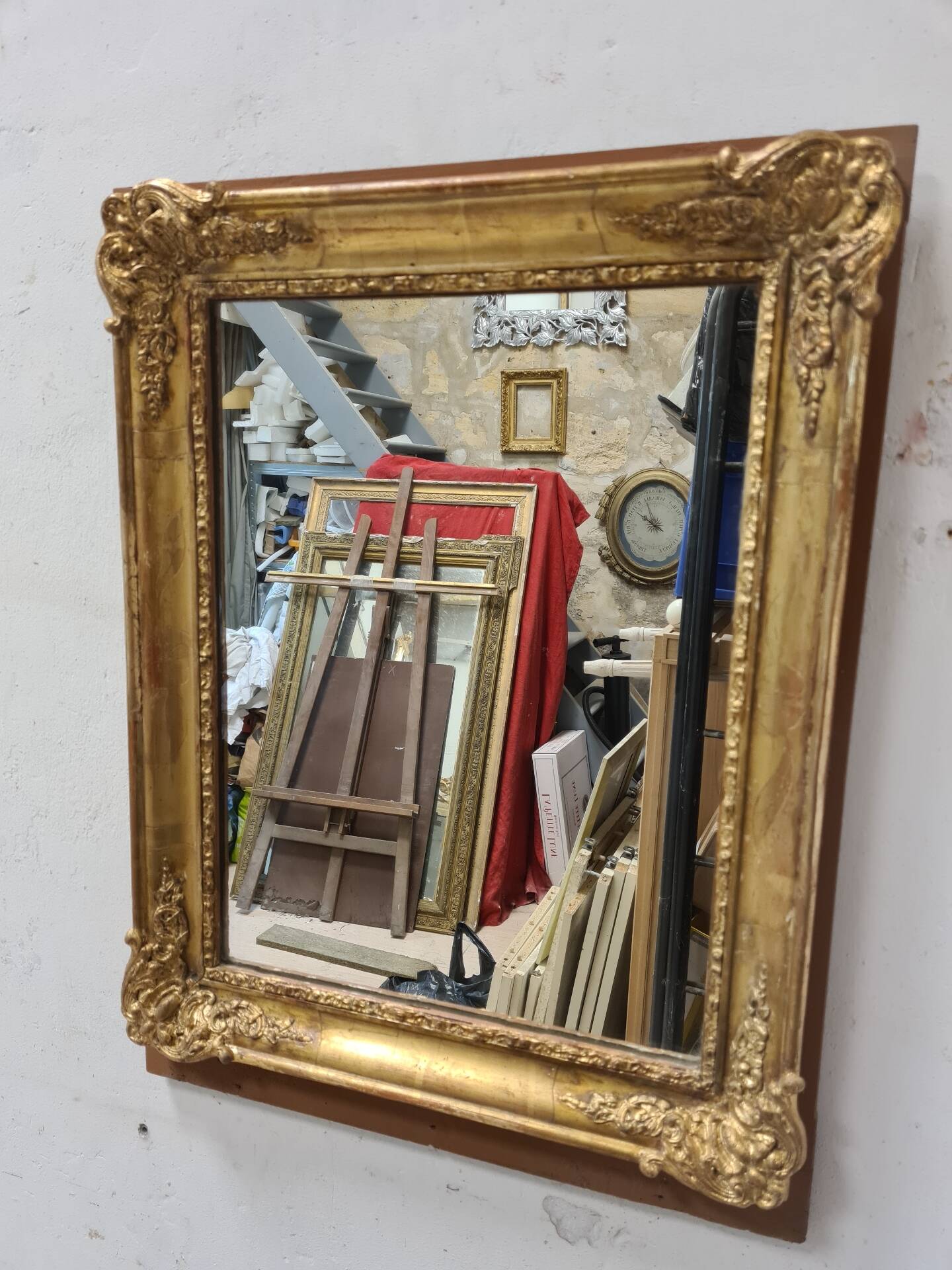 Antique gilded mirror, 19th century Empire style.