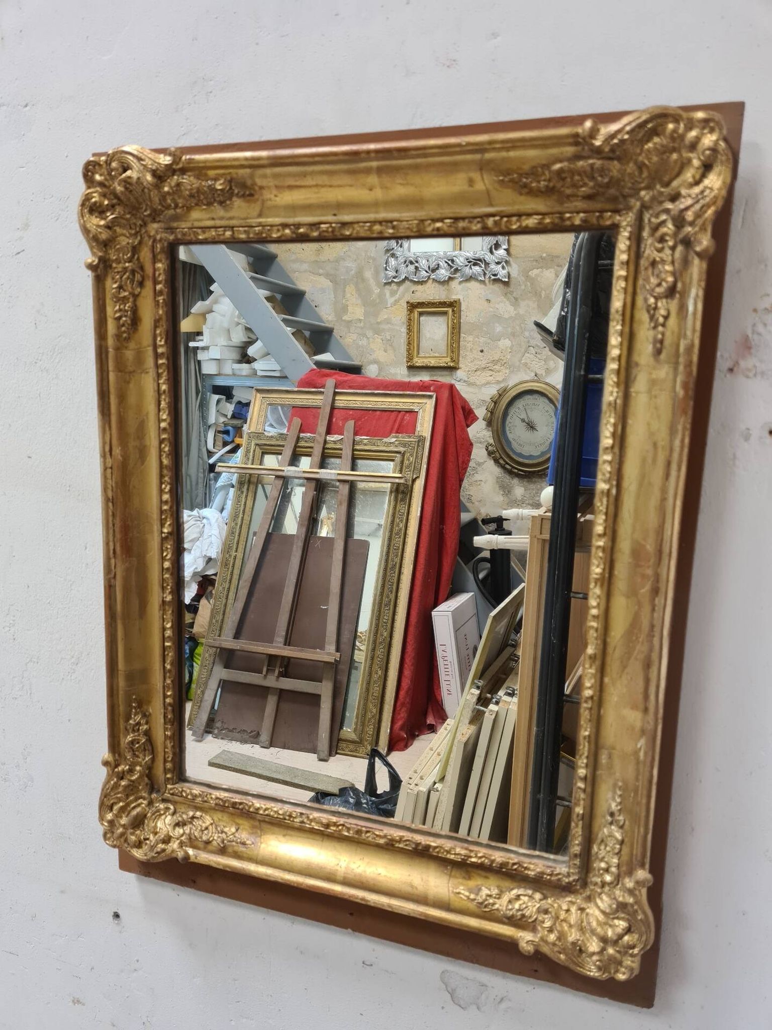 Antique gilded mirror, 19th century Empire style.