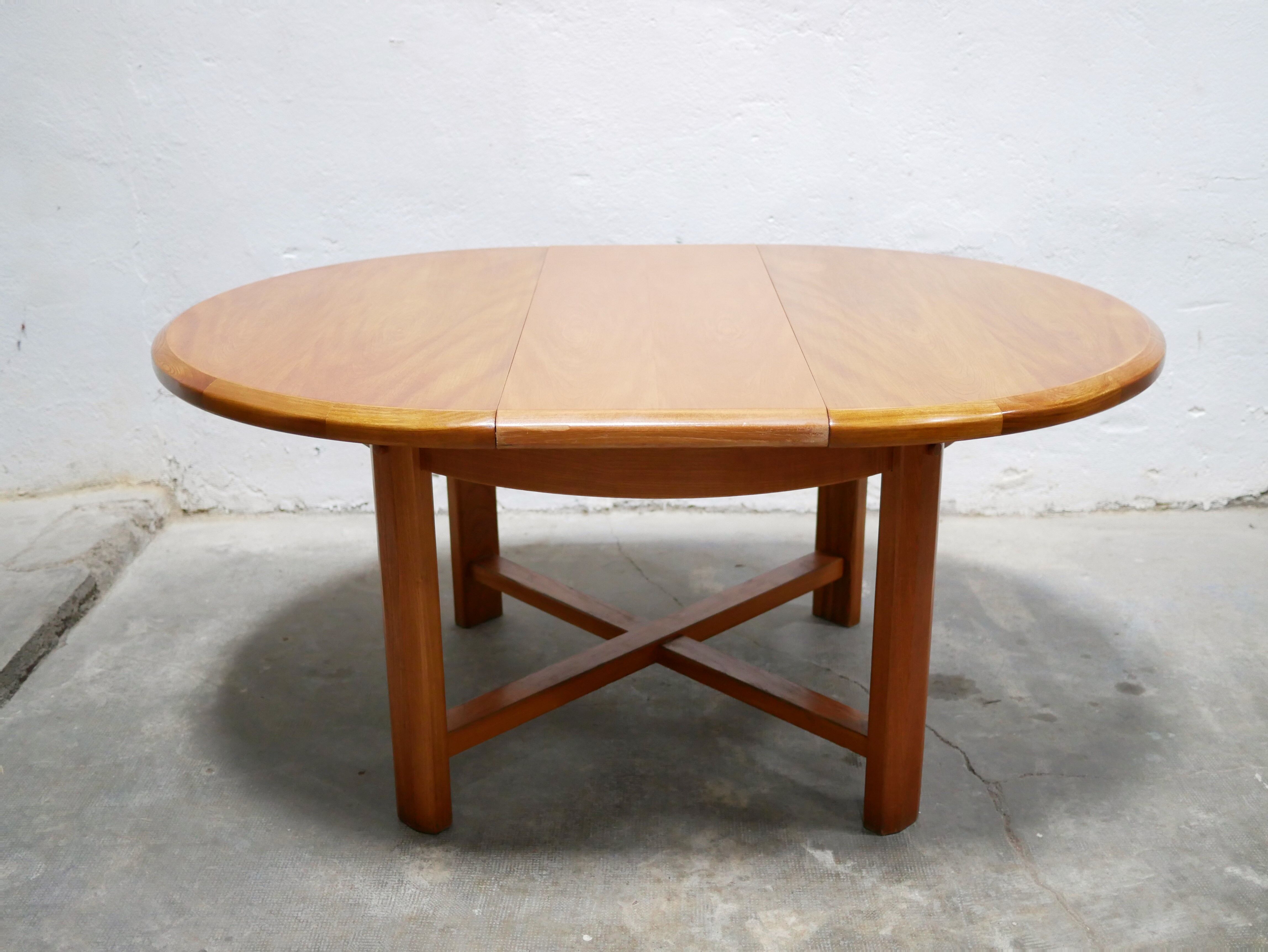 Vintage extendable round wooden dining table