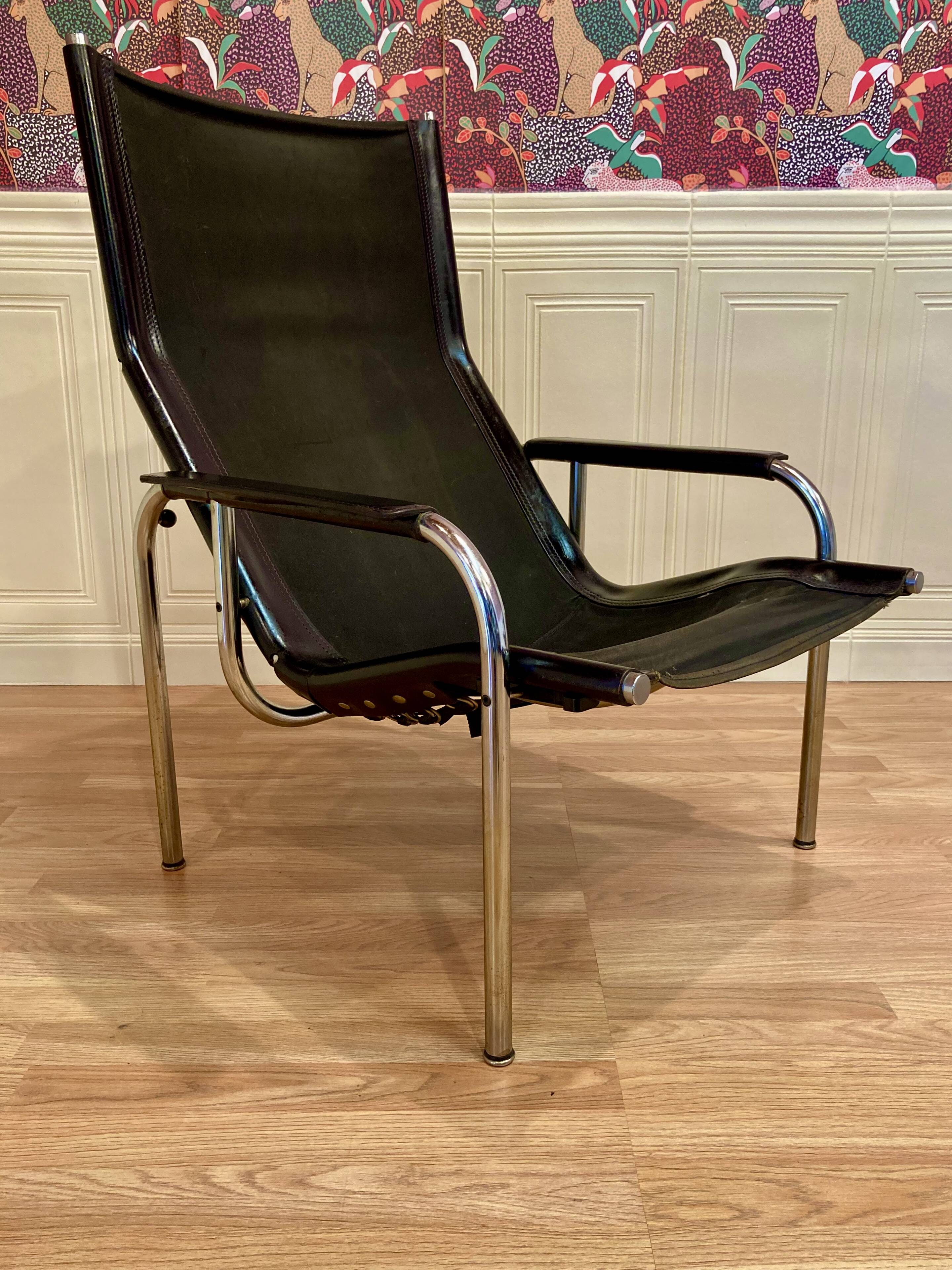 Reclining armchair in black leather and chrome design "hans eichenberger" 1960.