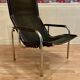 Reclining armchair in black leather and chrome design "hans eichenberger" 1960.