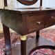 Empire hairdresser from the 19th century in mahogany with a marble top.
