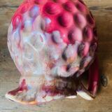 Old pitcher in burgundy ceramic