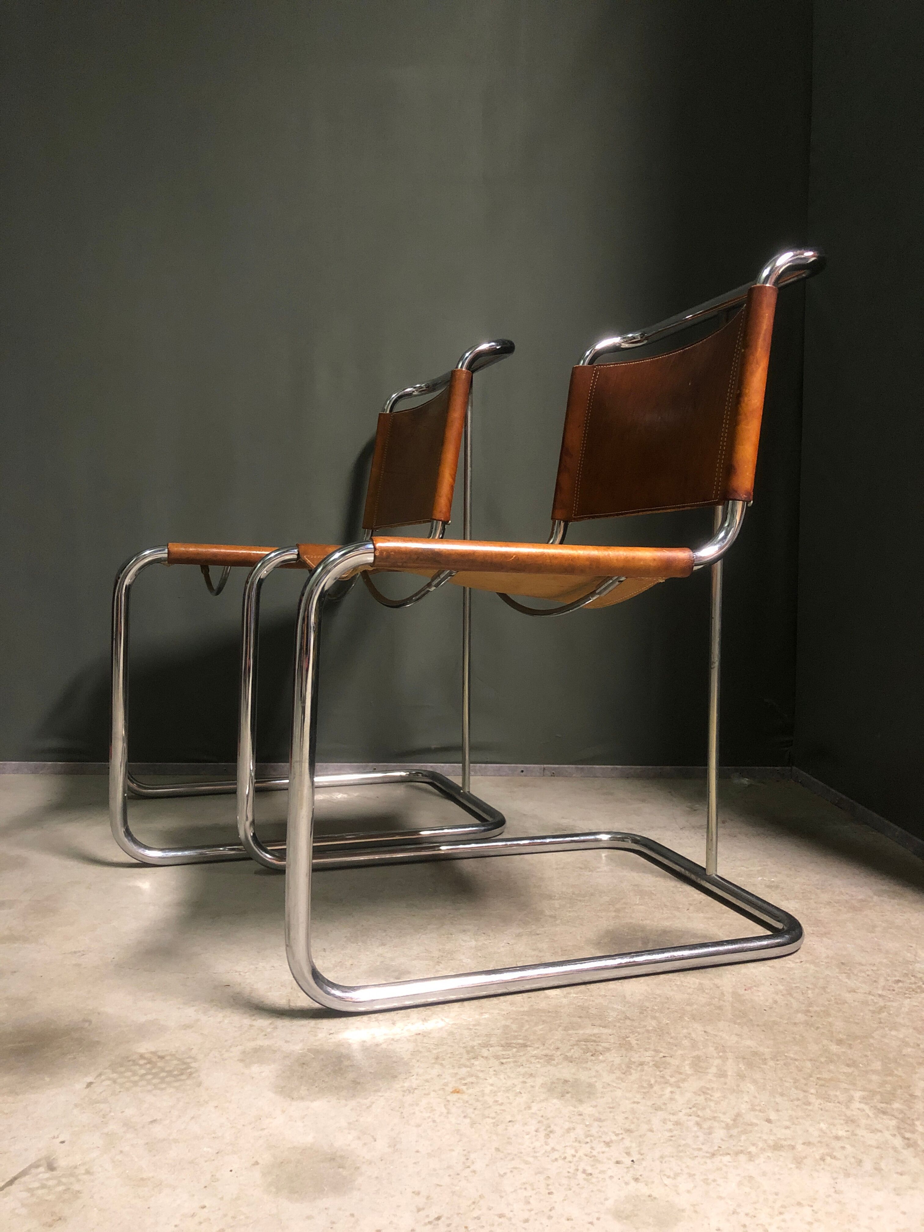 A pair of chromed tubular dining chairs 1980's