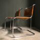 A pair of chromed tubular dining chairs 1980's
