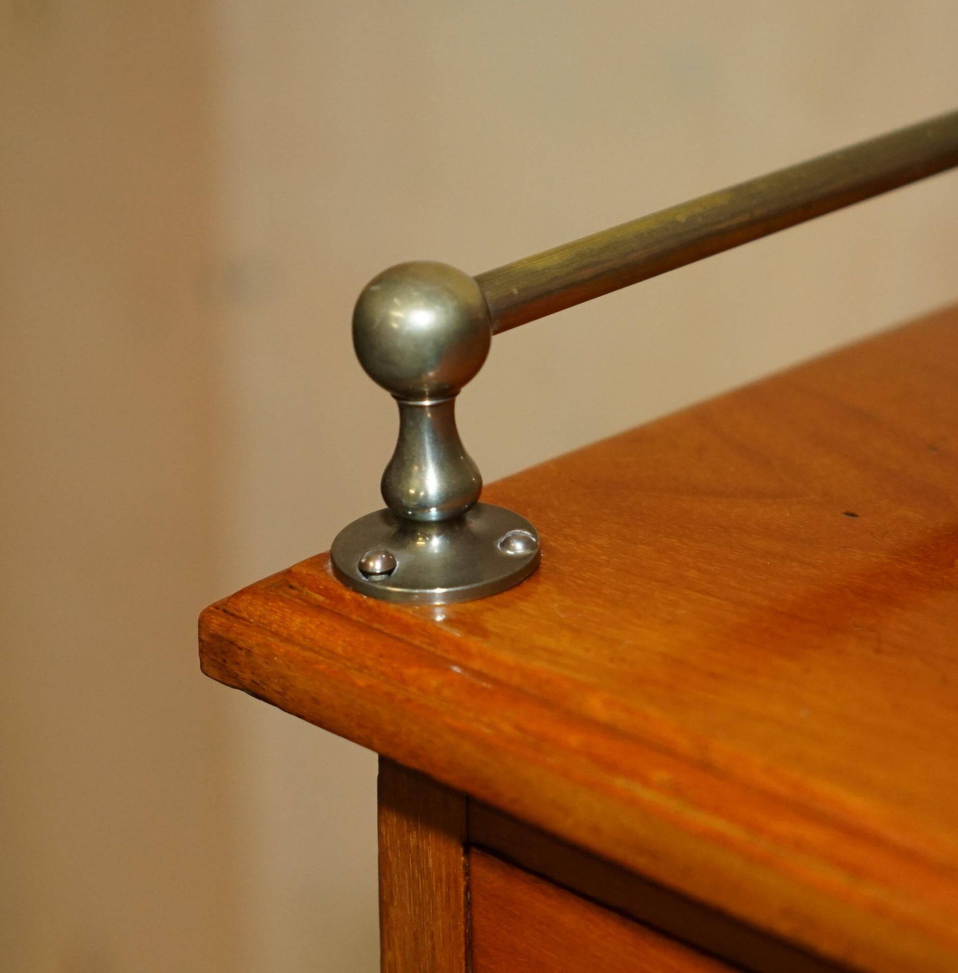 Victorian high chest of drawers in walnut with a bronze gallery.