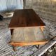 Antique Louis Philippe style farm table in solid cherry wood with turned base.