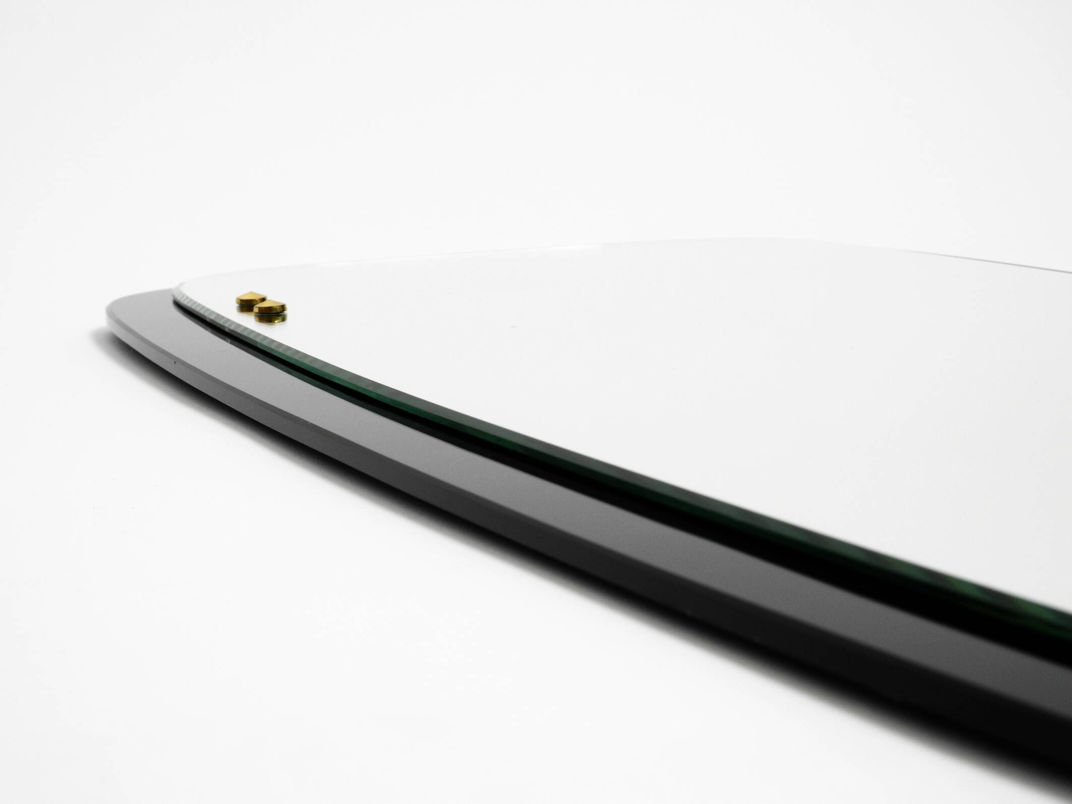 Large Mid Century wall mirror with extraordinary black glass frame