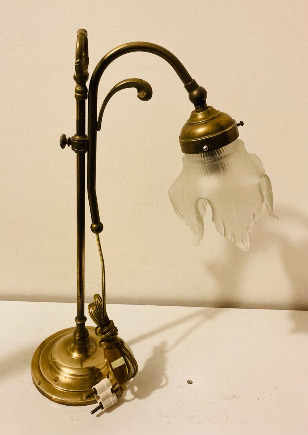 Brass table lamp with a glass shade