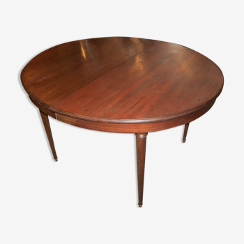 Oval mahogany table with extension cords