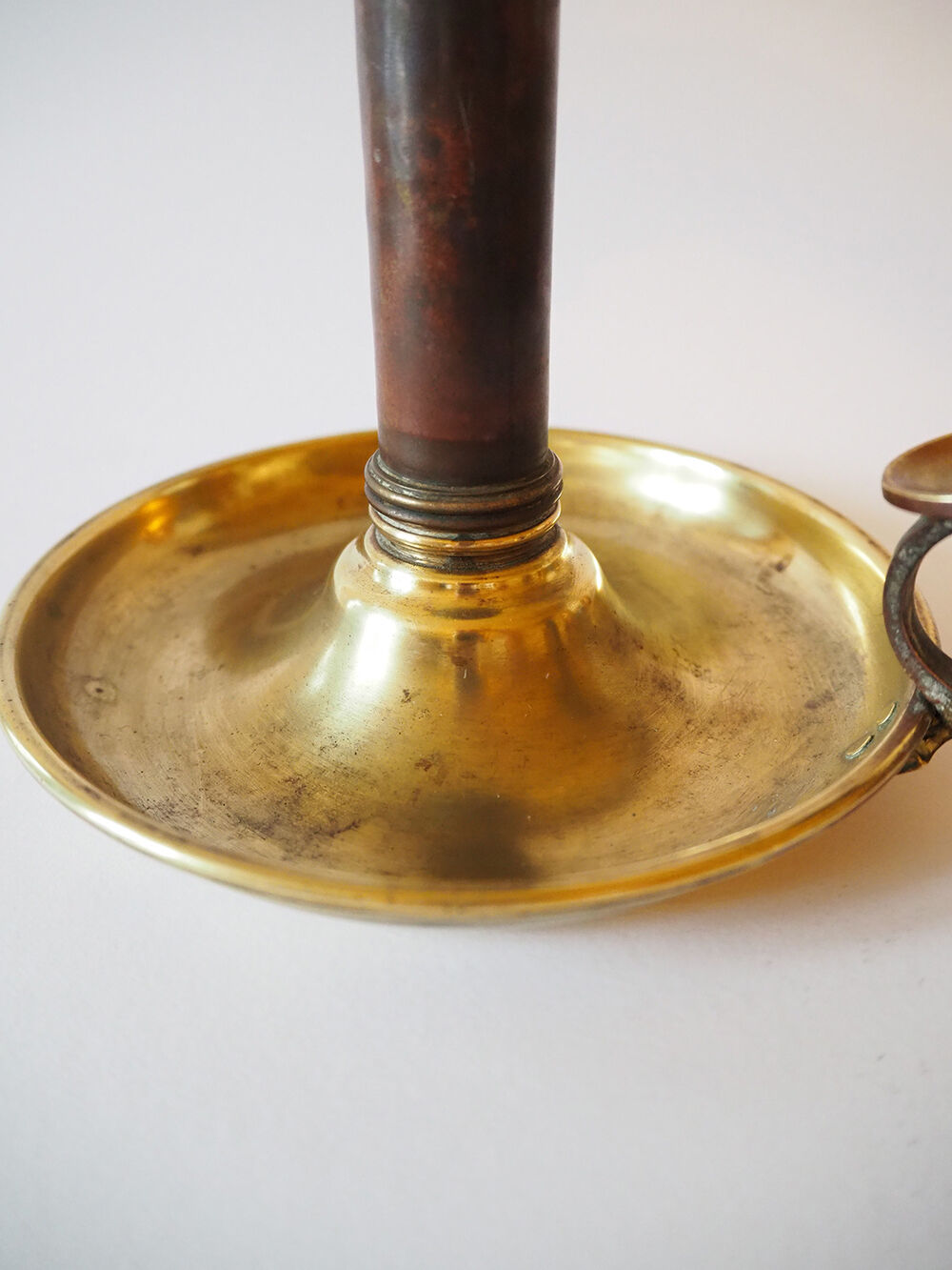 Set of three old brass candle holders