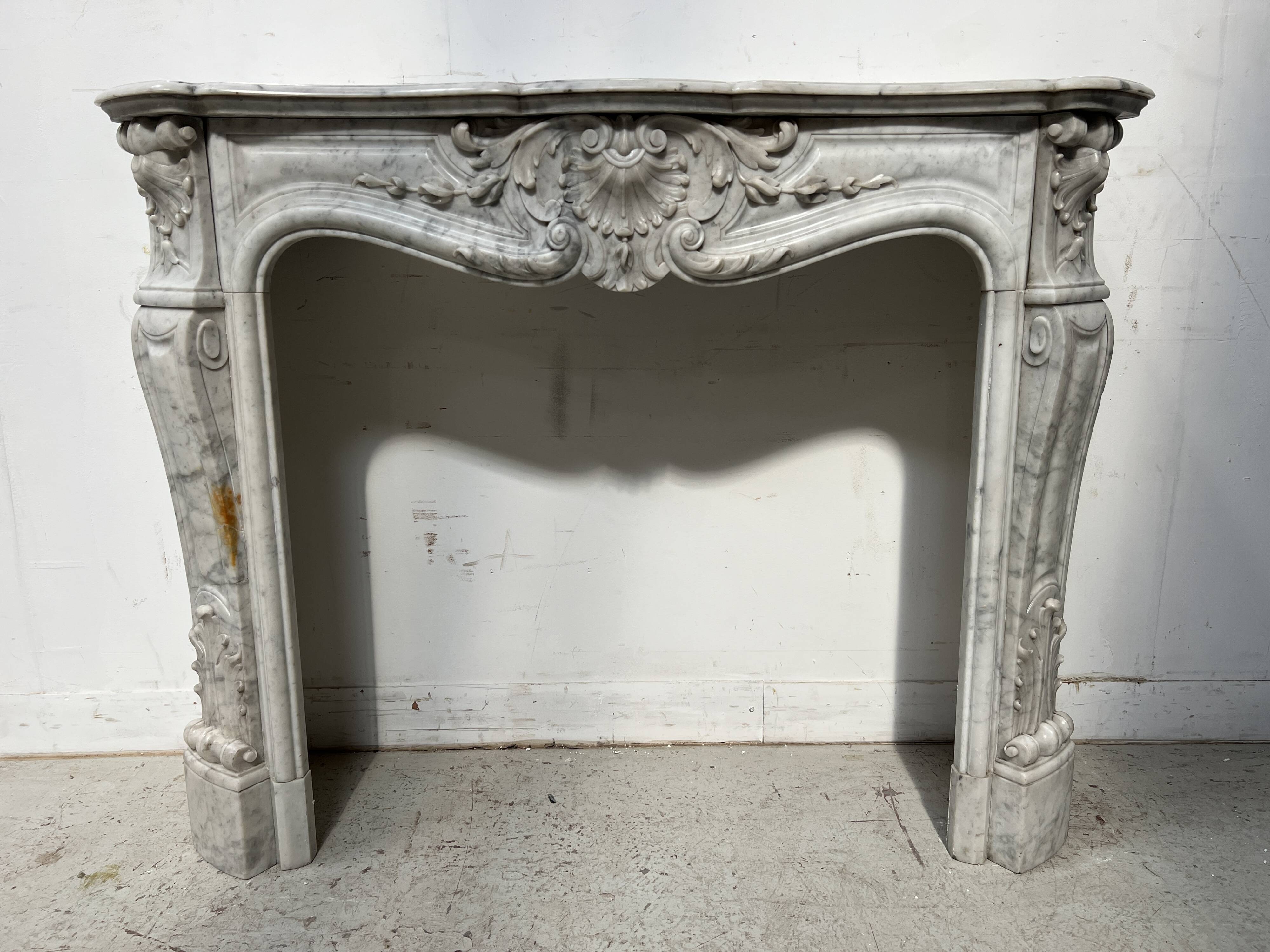 Louis XV style white Carrara marble fireplace, 19th century.