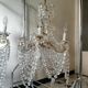 A pair of imposing, antique chandeliers with pendants.