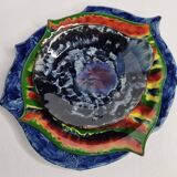 Suite of decorative plates empty enamelled terracotta pockets signed "Gerlou", unique pieces