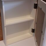 White mirrored toilet cabinet with floral pattern