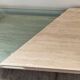 Table basse vintage en travertin et verre