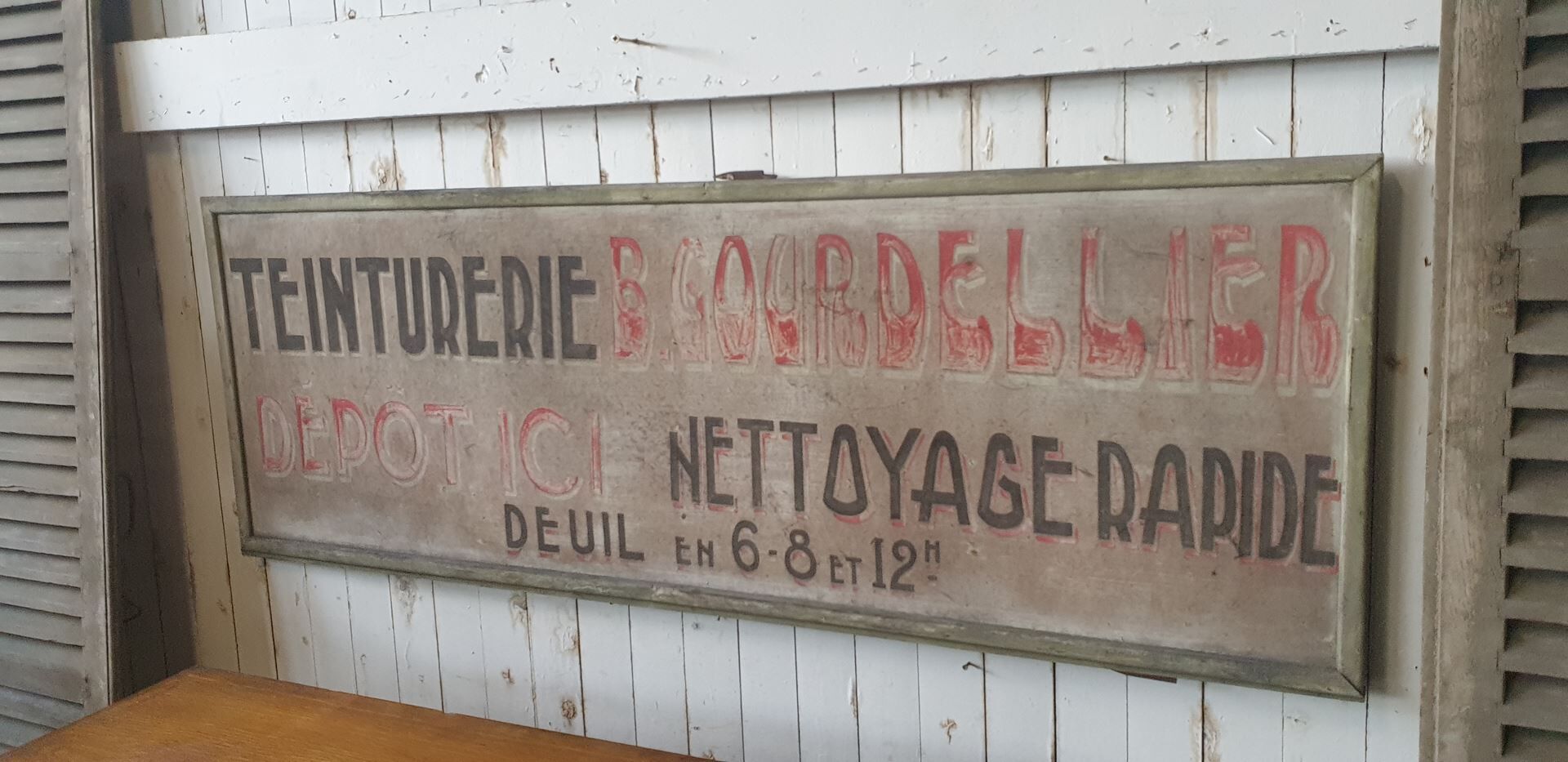 former big wooden advertising sign