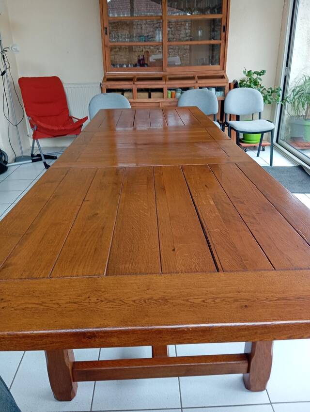 Large rectangular dining table in solid oak in a neo-rustic style.