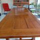 Large rectangular dining table in solid oak in a neo-rustic style.