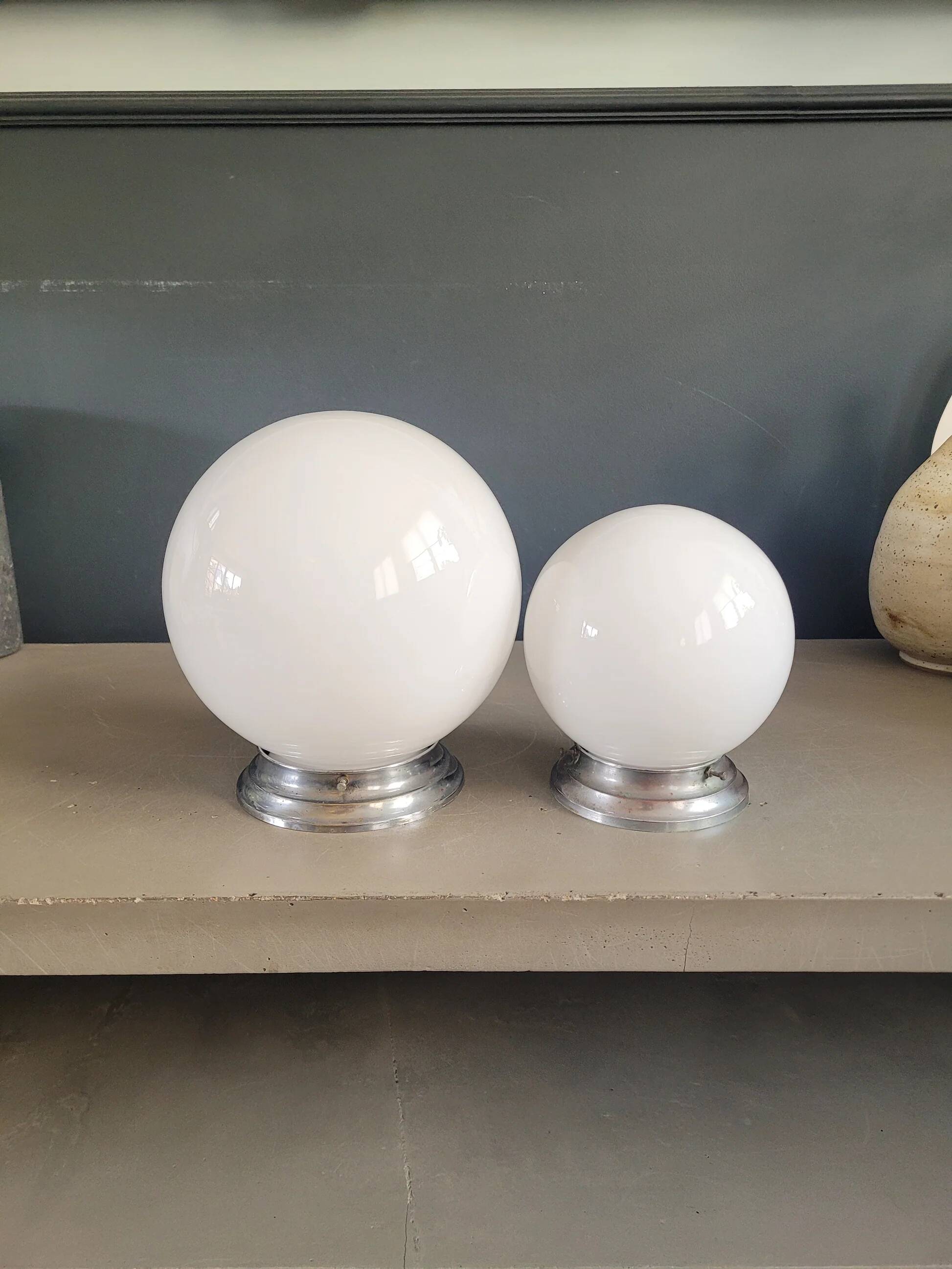 Pair of ceiling lights or wall lights with white glass globes.