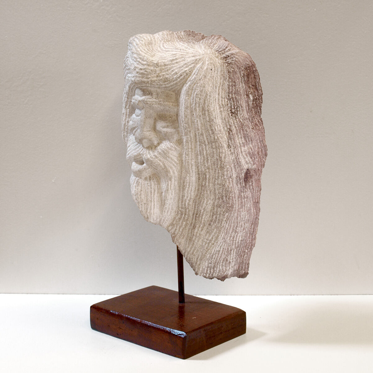 Carved stone head sculpture