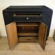 Matte black buffet and raw wood feet