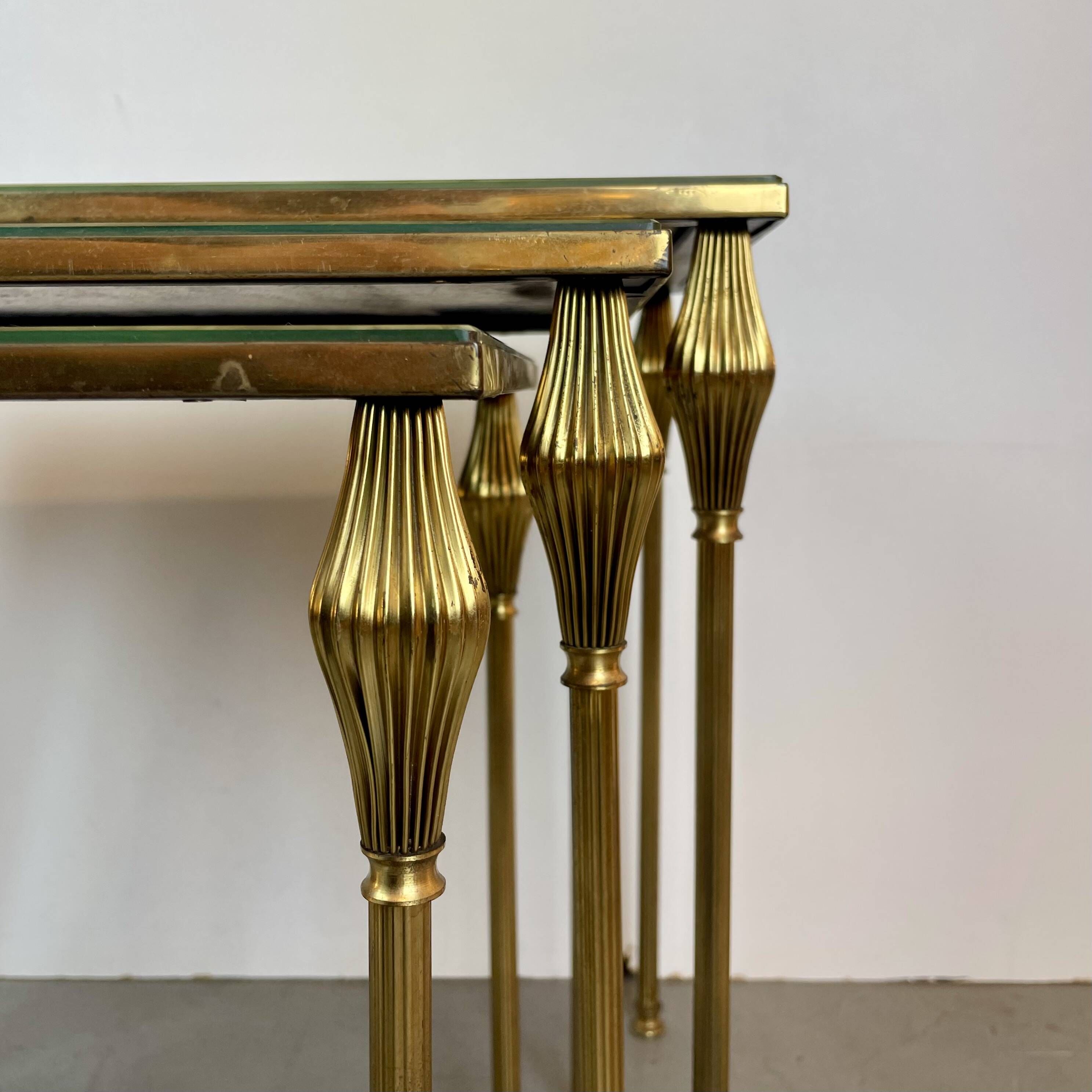 Nested brass tables, attributed to Maison Baguès, France, 1950–60.