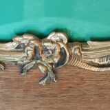 Old wooden frame and bronze ornament